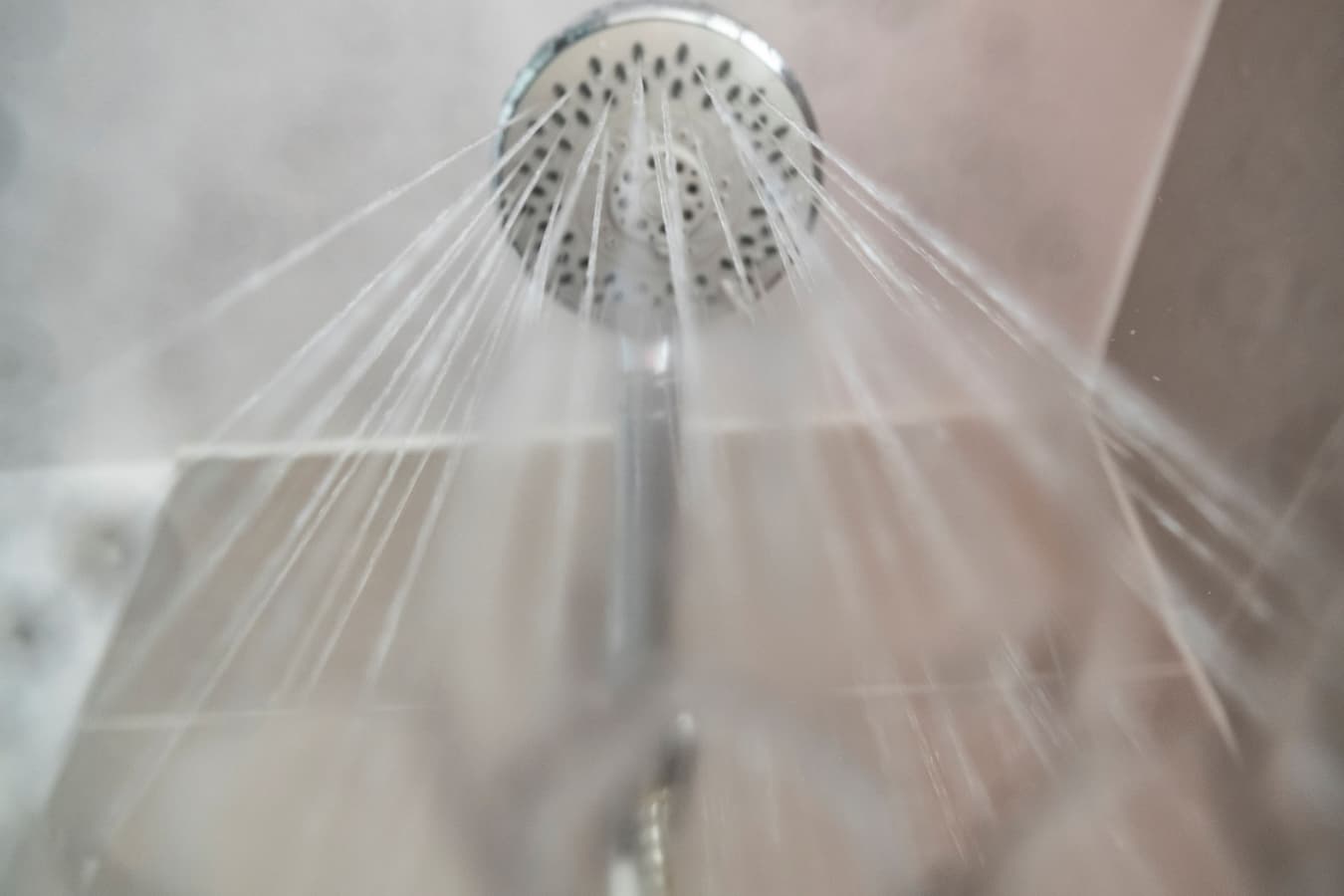 Water flowing from a shower head viewed from directly below