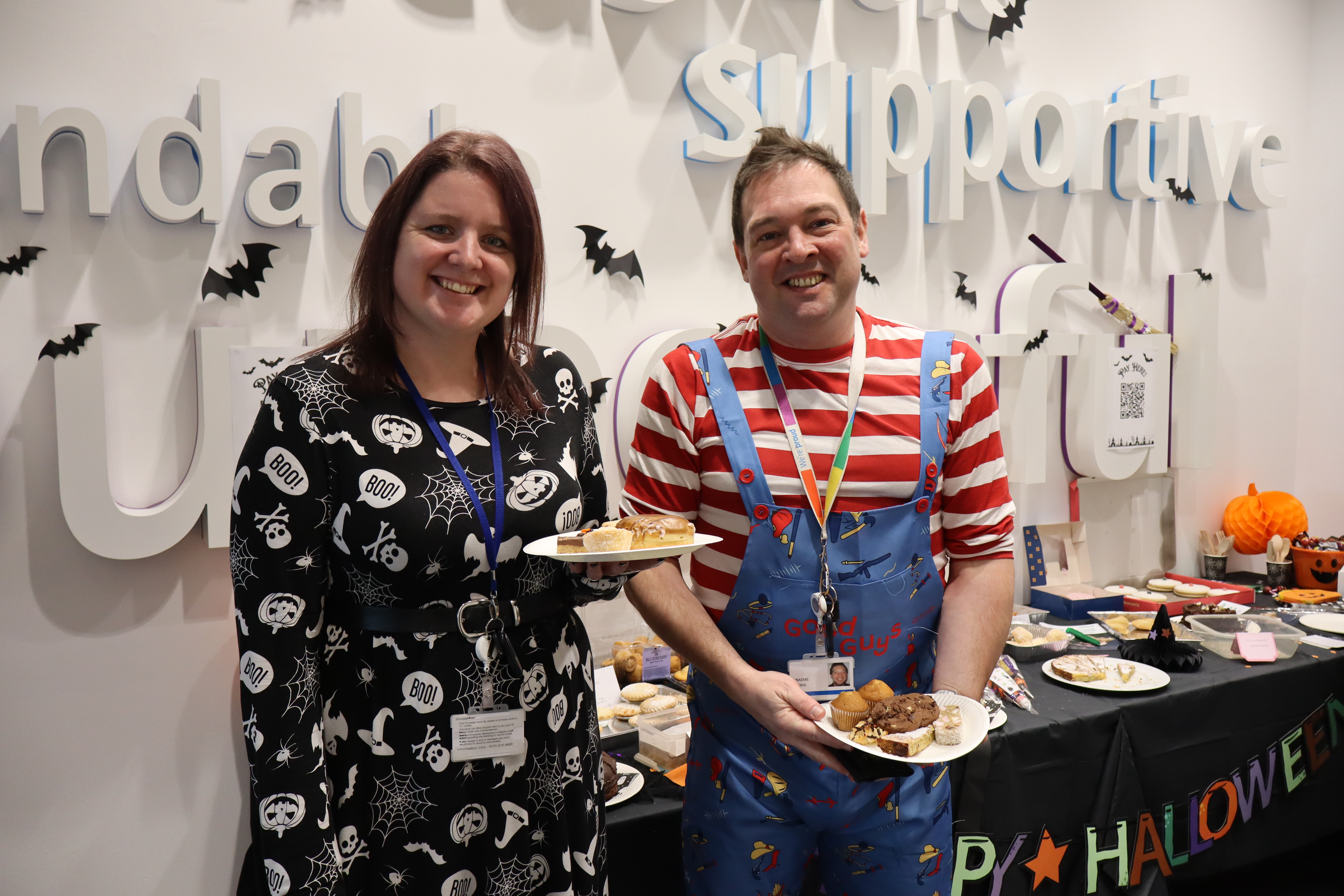 Two people at Halloween bake sale