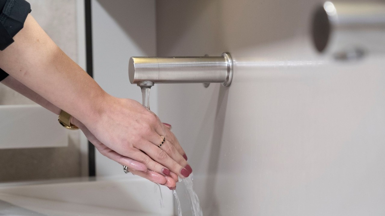 washing hands under tap