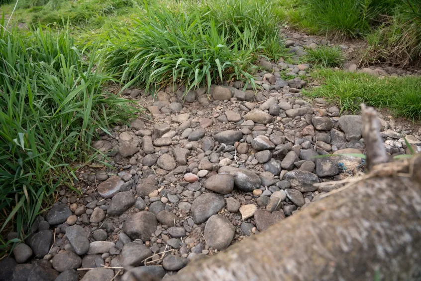Rocks and pebbles at the bottom of a dried up stream