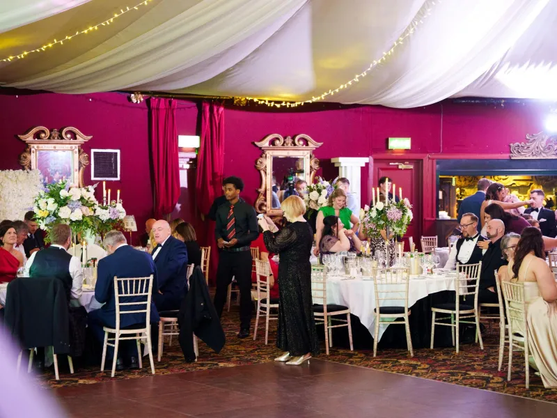 Business Stream colleagues celebrating in festive dinner surroundings at Awards Night