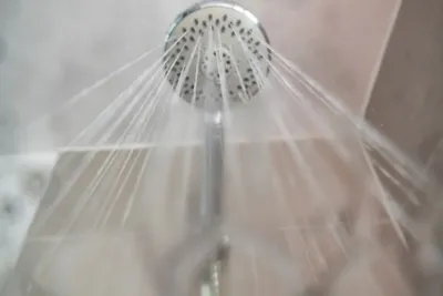 Water flowing from a shower head viewed from directly below