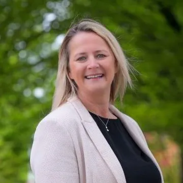 CFO Lynne Gilder with trees in background